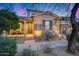 Beautiful brick home with a well-manicured front yard, desert landscaping, and a covered porch at 9439 E Trailside Vw, Scottsdale, AZ 85255