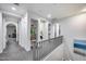 Hallway features neutral color palette, carpeted floor, art niches, and open doorways to rooms at 9439 E Trailside Vw, Scottsdale, AZ 85255