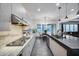 Contemporary kitchen with stone countertops, stainless steel appliances, and pendant lighting at 9439 E Trailside Vw, Scottsdale, AZ 85255