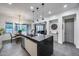 Spacious kitchen with an island, stainless steel appliances, and views of the dining and living area at 9439 E Trailside Vw, Scottsdale, AZ 85255