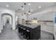 Modern kitchen features an island with seating, stainless steel appliances, and light gray cabinetry at 9439 E Trailside Vw, Scottsdale, AZ 85255