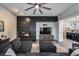 View of a living room featuring a fireplace, a ceiling fan, and a comfortable seating area at 9439 E Trailside Vw, Scottsdale, AZ 85255