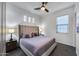 Comfortable main bedroom with plush bedding, modern lighting, and a ceiling fan at 9439 E Trailside Vw, Scottsdale, AZ 85255