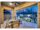 Relaxing patio with a brick archway, outdoor seating, BBQ, and a cozy fire pit at 9439 E Trailside Vw, Scottsdale, AZ 85255