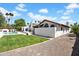 Spacious backyard featuring lush lawn, pool, and patio area, perfect for outdoor entertaining at 9760 E San Salvador Dr, Scottsdale, AZ 85258