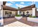 Spacious backyard patio featuring a tiled surface, cozy seating area, and lush landscaping at 9760 E San Salvador Dr, Scottsdale, AZ 85258
