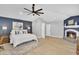 Spacious bedroom features a fireplace, ceiling fan, and neutral decor at 9760 E San Salvador Dr, Scottsdale, AZ 85258