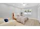 Minimalist bedroom with a wood frame bed, soft gray walls, and natural light from shuttered window at 9760 E San Salvador Dr, Scottsdale, AZ 85258