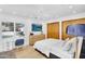 Bright bedroom with wooden closet, desk, TV, ceiling fan and backyard views at 9760 E San Salvador Dr, Scottsdale, AZ 85258