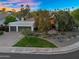 Beautiful home exterior with a spacious driveway and meticulously landscaped front yard at 9760 E San Salvador Dr, Scottsdale, AZ 85258