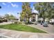 Charming home with beautifully landscaped front yard, mature trees and a welcoming facade at 9760 E San Salvador Dr, Scottsdale, AZ 85258