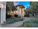 Charming home with beautifully landscaped front yard, mature trees and a welcoming facade at 9760 E San Salvador Dr, Scottsdale, AZ 85258