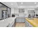 Bright kitchen with stainless steel appliances, farmhouse sink, and a large window at 9760 E San Salvador Dr, Scottsdale, AZ 85258