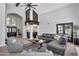 Spacious living room showcasing vaulted ceilings, a cozy seating area, and stylish decor at 9760 E San Salvador Dr, Scottsdale, AZ 85258