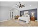 Tranquil main bedroom with vaulted ceilings, an accent wall, and a dedicated desk space at 9760 E San Salvador Dr, Scottsdale, AZ 85258