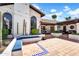 Charming outdoor patio with built-in seating, desert landscaping, and stylish tile work, perfect for entertaining at 9760 E San Salvador Dr, Scottsdale, AZ 85258