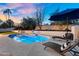 Private backyard pool area with lounge chairs, mature trees, and ample space for relaxing and enjoying the outdoors at 9760 E San Salvador Dr, Scottsdale, AZ 85258