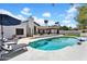 Stunning backyard showcasing a sparkling pool, inviting lounge chairs, and a charming patio for outdoor enjoyment at 9760 E San Salvador Dr, Scottsdale, AZ 85258