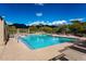 Community pool featuring mountain views and desert landscaping at 10219 E Le Marche Dr, Scottsdale, AZ 85255