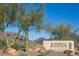 McDowell Mountain Ranch entrance sign with desert landscaping and mountain views on a clear, sunny day at 10219 E Le Marche Dr, Scottsdale, AZ 85255