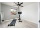Bright exercise room equipped with a spin bike, weights, and a full-length mirror at 10219 E Le Marche Dr, Scottsdale, AZ 85255