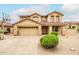 Stunning two-story home with a spacious driveway, desert landscaping, and an attached two-car garage at 10219 E Le Marche Dr, Scottsdale, AZ 85255