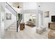Inviting foyer showcasing a staircase with metal railings, an art niche, and easy access to the dining room at 10219 E Le Marche Dr, Scottsdale, AZ 85255