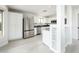 Modern kitchen featuring white cabinetry, stainless steel appliances, and sleek countertops at 10219 E Le Marche Dr, Scottsdale, AZ 85255
