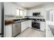 Modern kitchen featuring stainless steel appliances, sleek countertops, and ample cabinet space at 10219 E Le Marche Dr, Scottsdale, AZ 85255