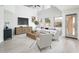 Bright living room featuring tall windows, modern furniture, and seamless access to the outdoor spaces at 10219 E Le Marche Dr, Scottsdale, AZ 85255