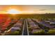 Aerial view of community featuring sunset and landscaping at 10260 W Pinnacle Vista Dr, Peoria, AZ 85383