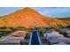 Aerial community view showing sunset and manicured streetscaping at 10260 W Pinnacle Vista Dr, Peoria, AZ 85383