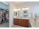Elegant bathroom with a double vanity, chrome fixtures, and recessed lighting, plus walk in closet at 10260 W Pinnacle Vista Dr, Peoria, AZ 85383