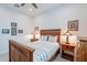 Comfortable bedroom featuring stylish furniture, a ceiling fan, and ample natural light at 10260 W Pinnacle Vista Dr, Peoria, AZ 85383