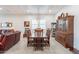 Elegant dining room with wood furniture, recessed lighting, and plantation shutters on the windows at 10260 W Pinnacle Vista Dr, Peoria, AZ 85383