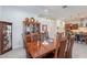 Open floor plan with a dining area with wood table and chairs and hutch for storage at 10260 W Pinnacle Vista Dr, Peoria, AZ 85383