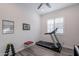 Home exercise room with a treadmill, free weights, and a bright window for natural light at 10260 W Pinnacle Vista Dr, Peoria, AZ 85383