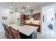 Bright kitchen with a large center island, stainless steel appliances, and modern lighting fixtures at 10260 W Pinnacle Vista Dr, Peoria, AZ 85383