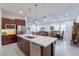 Spacious kitchen with center island and open to the living and dining areas at 10260 W Pinnacle Vista Dr, Peoria, AZ 85383