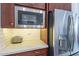 Kitchen with stainless steel appliances, subway tile backsplash, and ample counter space at 10260 W Pinnacle Vista Dr, Peoria, AZ 85383