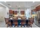 Modern kitchen with stainless steel appliances, center island, and a subway tile backsplash at 10260 W Pinnacle Vista Dr, Peoria, AZ 85383