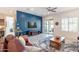 Open floor plan living room features a ceiling fan and sliding glass doors at 10260 W Pinnacle Vista Dr, Peoria, AZ 85383