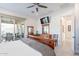 Well-lit main bedroom featuring wood furniture and a ceiling fan with an outdoor view at 10260 W Pinnacle Vista Dr, Peoria, AZ 85383