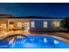 Backyard features a pebble tec pool, outdoor kitchen, and patio perfect for relaxation at 10260 W Pinnacle Vista Dr, Peoria, AZ 85383