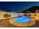 Relaxing backyard features a pebble tec pool, rock water feature, and built in barbeque at 10260 W Pinnacle Vista Dr, Peoria, AZ 85383