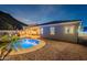 The backyard features a pebble tec pool, outdoor kitchen, and patio perfect for entertaining at 10260 W Pinnacle Vista Dr, Peoria, AZ 85383