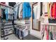 Organized walk-in closet with shelving, hanging space, and clothing at 10260 W Pinnacle Vista Dr, Peoria, AZ 85383