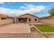 View of backyard featuring spacious patio, desert landscaping, and block fence at 10835 W Saddlehorn Rd, Peoria, AZ 85383