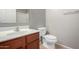 Well lit bathroom features a single sink vanity, tiled floors, and toilet at 10835 W Saddlehorn Rd, Peoria, AZ 85383