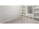 Bedroom with a built-in bookshelf on the wall and carpeted floors at 10835 W Saddlehorn Rd, Peoria, AZ 85383